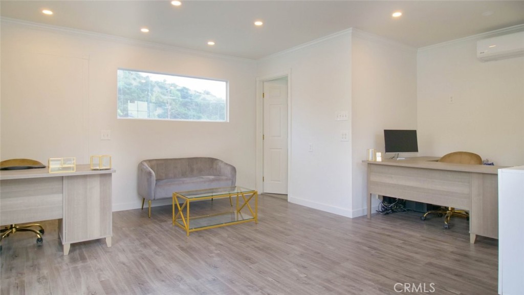7157 Foothill Boulevard Tujunga, CA 91042 - Photo 14 of 20 a living room with furniture and a fireplace
