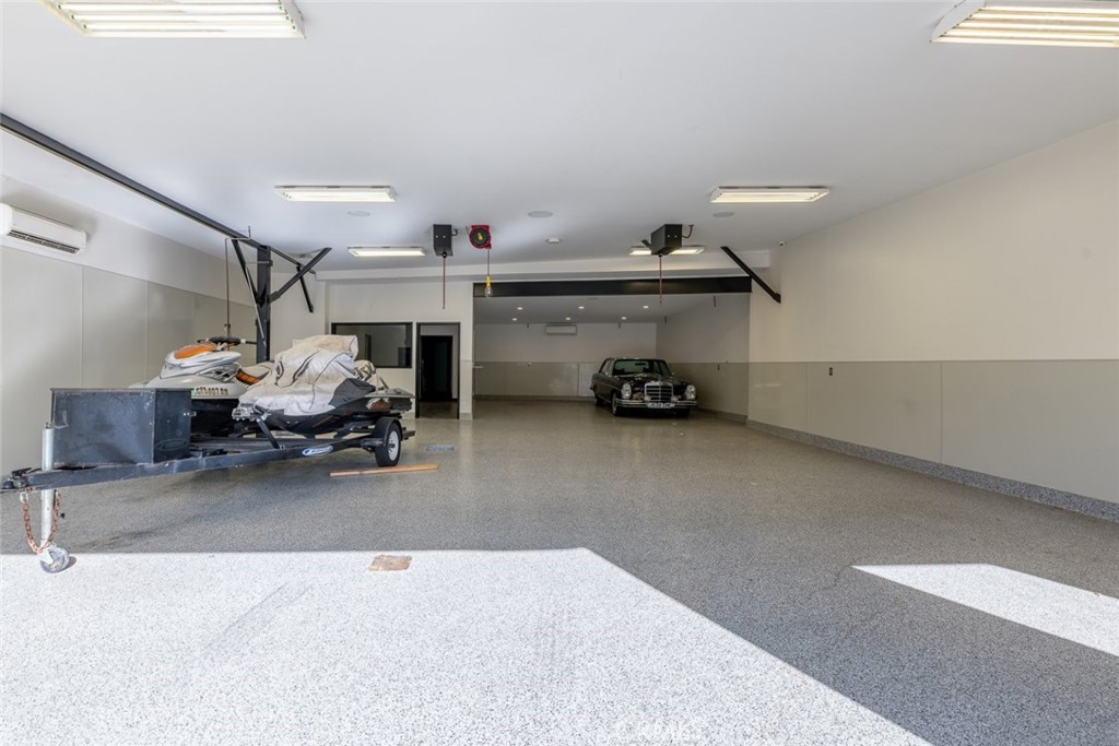 7157 Foothill Boulevard Tujunga, CA 91042 - Photo 5 of 20 a bedroom with furniture and a chandelier