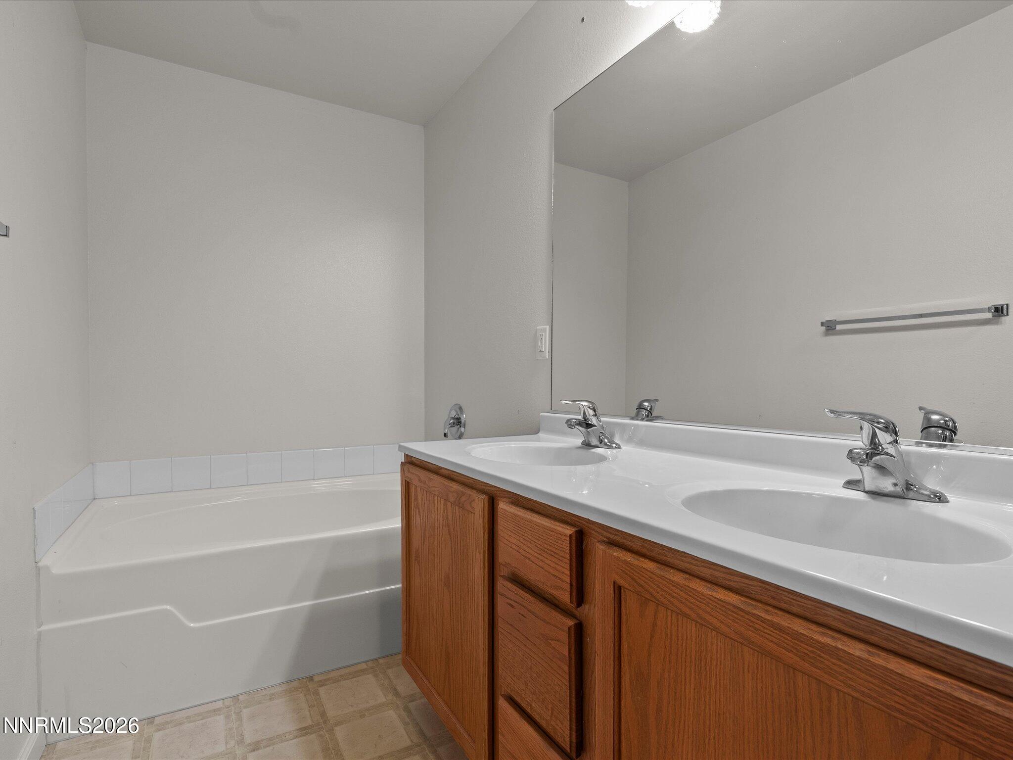 894 Timothy Way Fallon, NV 89406 - Photo 25 of 44 Primary view of bathtub and double sinks