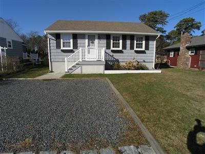 83 Uncle Rolf Road Dennis Port, MA 02639 - Photo 1 of 7 a front view of a house with a yard