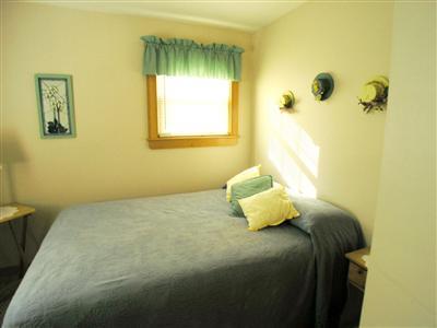 83 Uncle Rolf Road Dennis Port, MA 02639 - Photo 5 of 7 a bedroom with a bed and a window