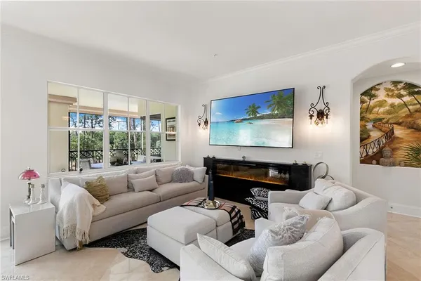 a living room with furniture and a flat screen tv