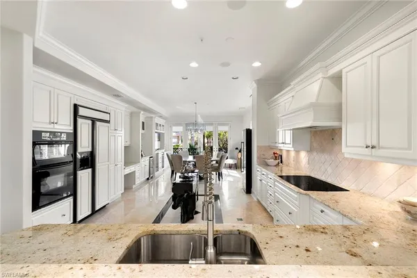 a view of a living room and kitchen