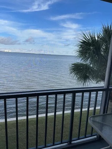 a living room with fireplace furniture and a wooden floor