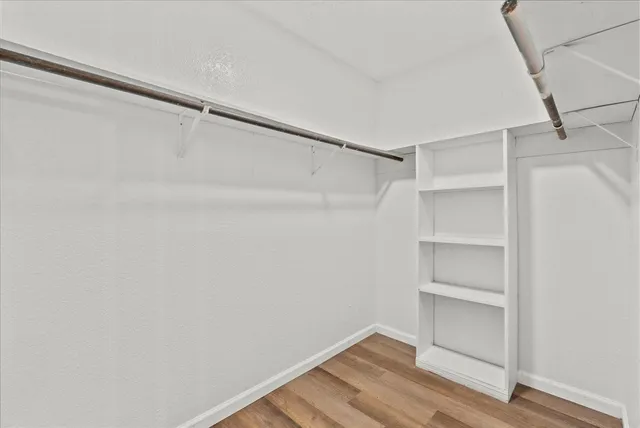 a view of an empty walk in closet