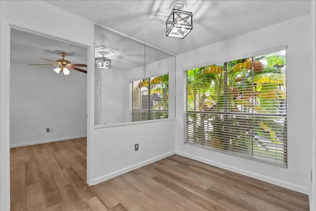 a view of an entryway with wooden floor