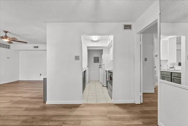 a view of a livingroom with wooden floor