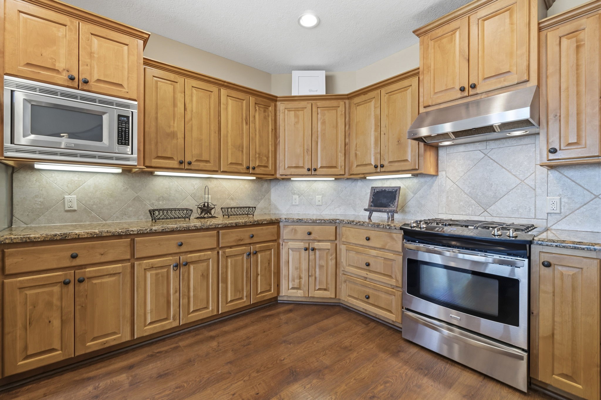 259 Memphis Bell Lane Trinity, TX 75862 - Photo 9 of 50 a kitchen with granite countertop cabinets stainless steel appliances and a sink