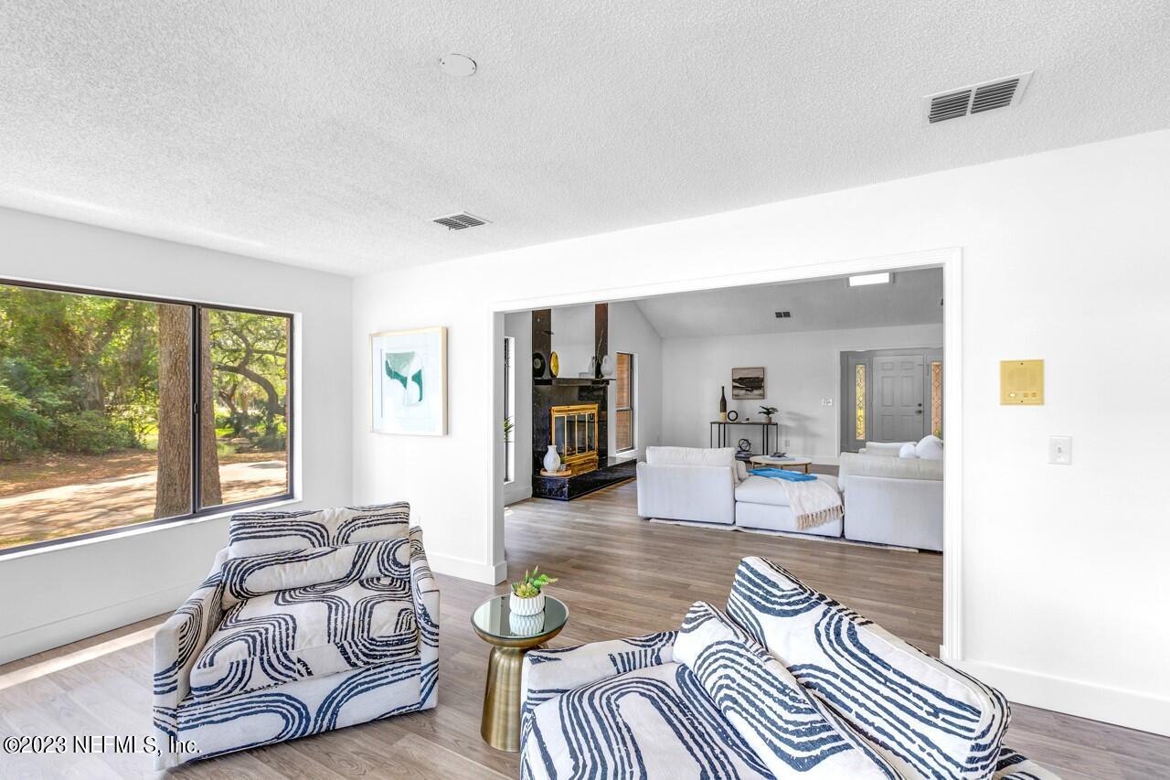 4309 Monument Road Jacksonville, FL 32225 - Photo 11 of 65 a living room with furniture and a large window