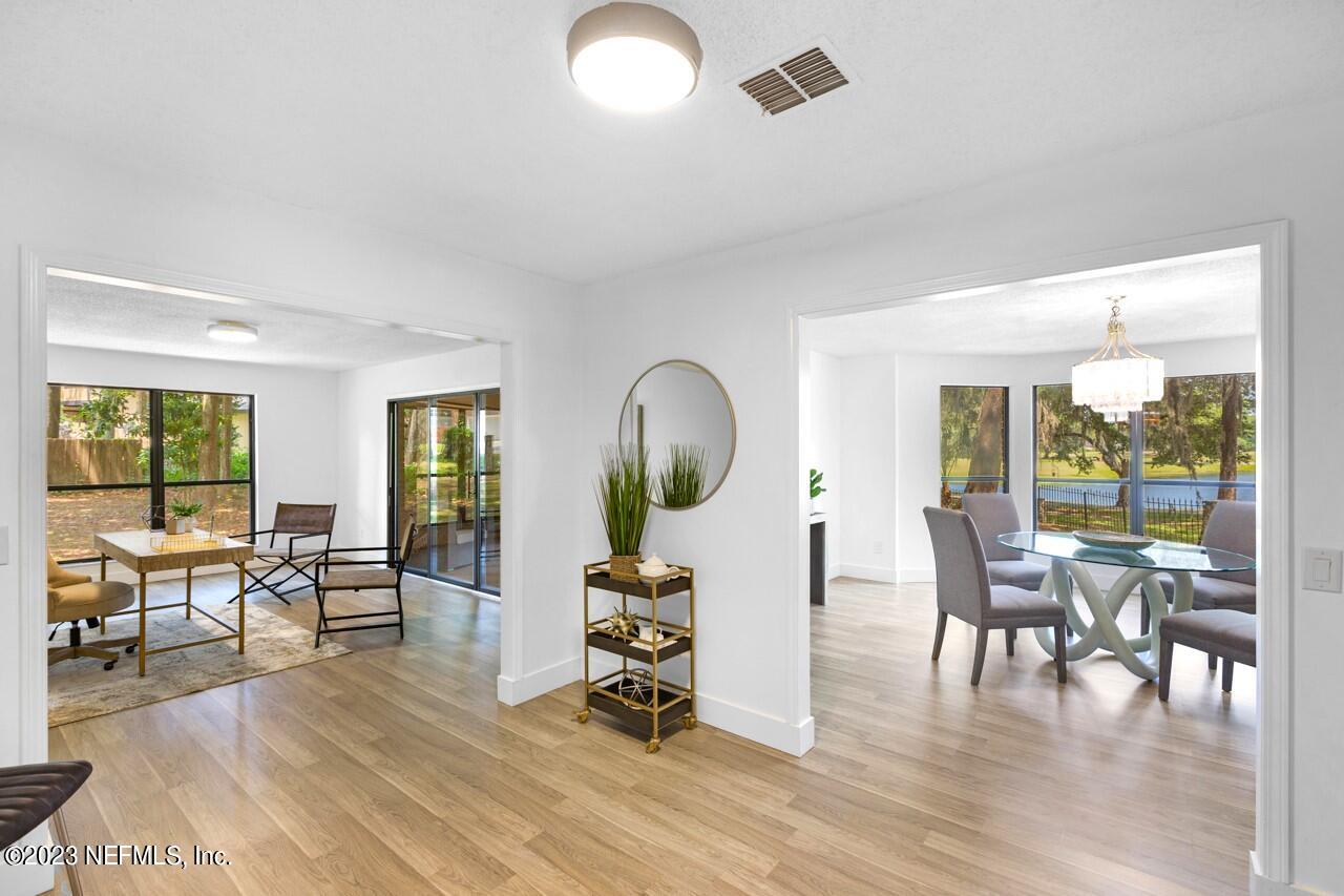 4309 Monument Road Jacksonville, FL 32225 - Photo 21 of 65 a living room with furniture couches and a large window