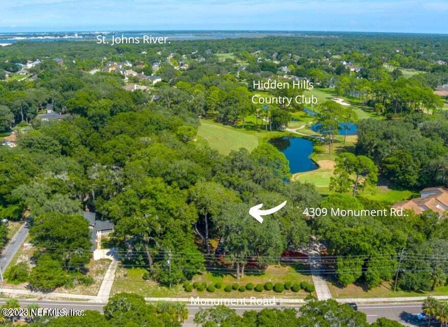4309 Monument Road Jacksonville, FL 32225 - Photo 3 of 65 an aerial view of residential houses with outdoor space and trees