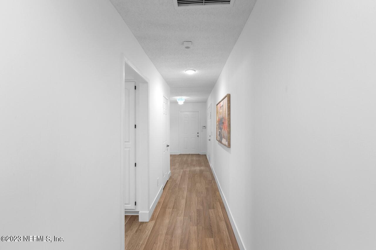 4309 Monument Road Jacksonville, FL 32225 - Photo 33 of 65 a view of a hallway with wooden floor