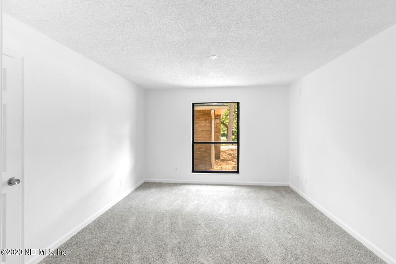 4309 Monument Road Jacksonville, FL 32225 - Photo 45 of 65 an empty room with a window