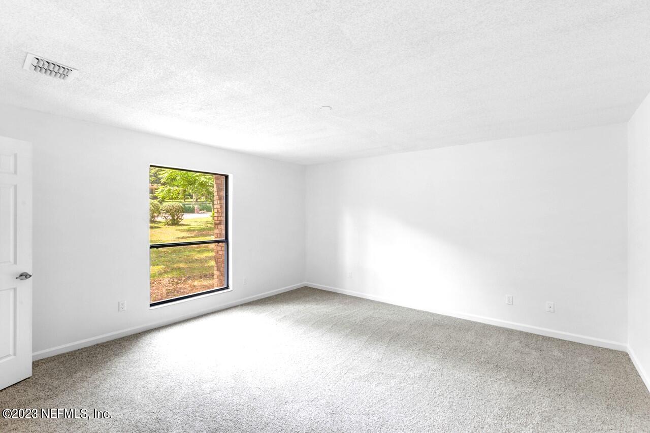 4309 Monument Road Jacksonville, FL 32225 - Photo 46 of 65 a view of an empty room with a window