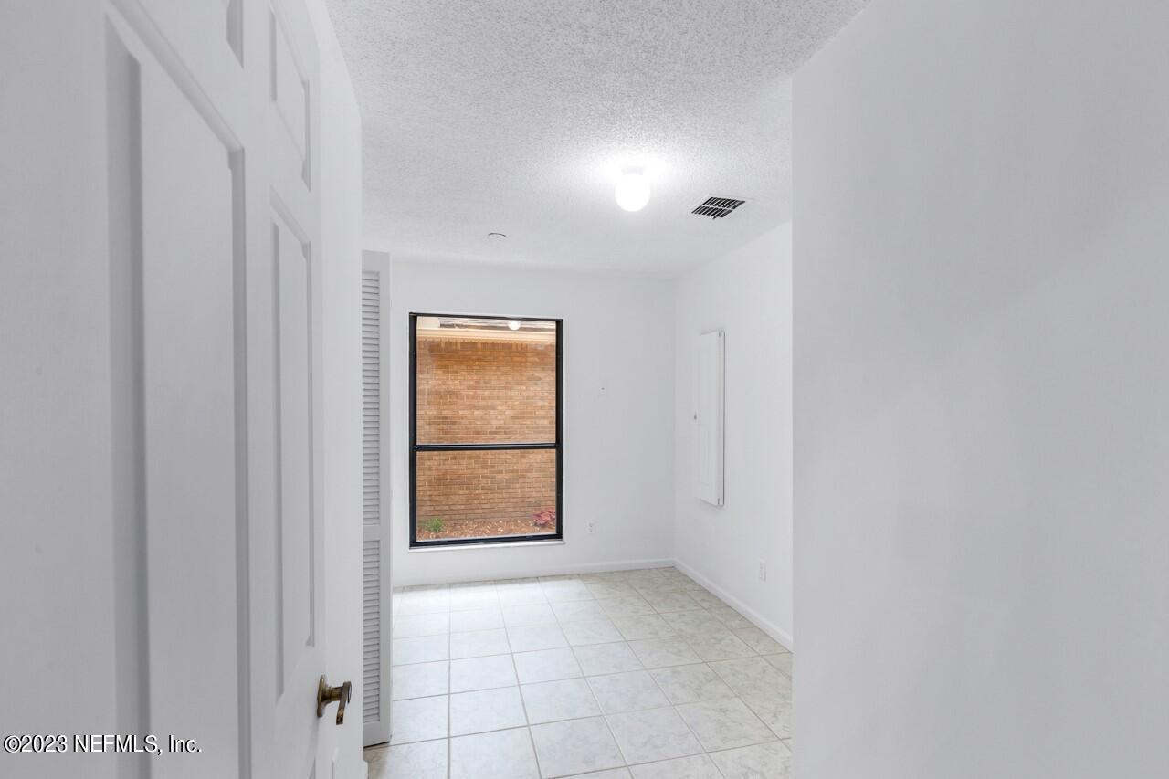 4309 Monument Road Jacksonville, FL 32225 - Photo 51 of 65 a view of an empty room with a window