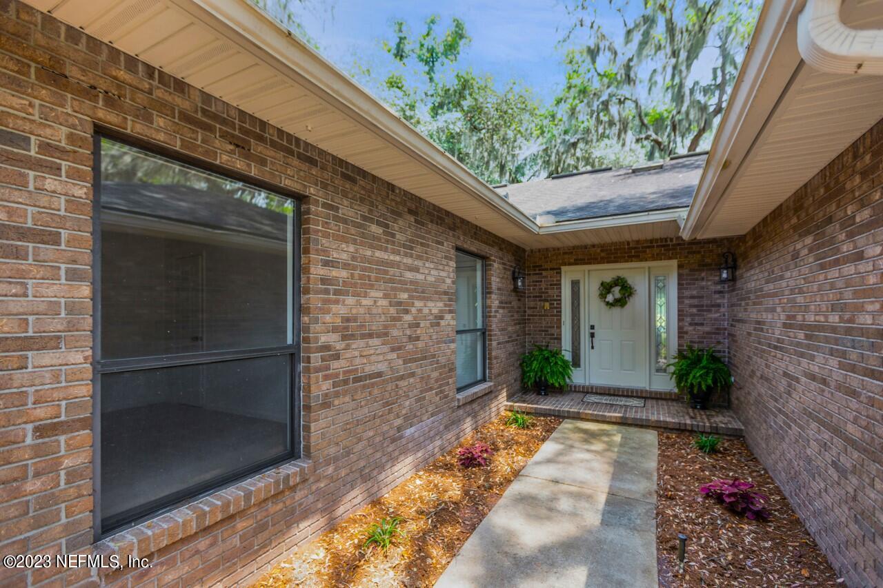 4309 Monument Road Jacksonville, FL 32225 - Photo 56 of 65 a front view of a house with a porch