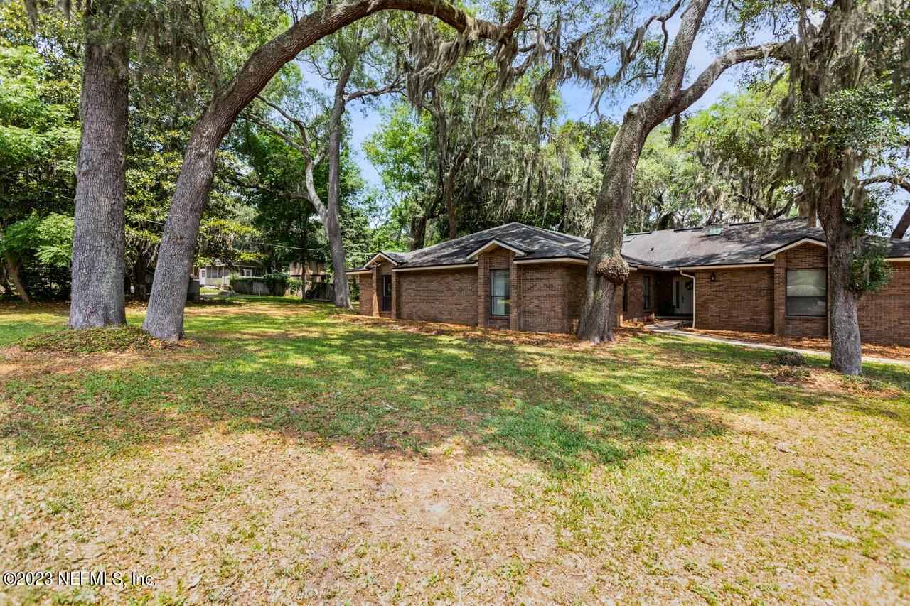 4309 Monument Road Jacksonville, FL 32225 - Photo 57 of 65 a front view of a house with a garden