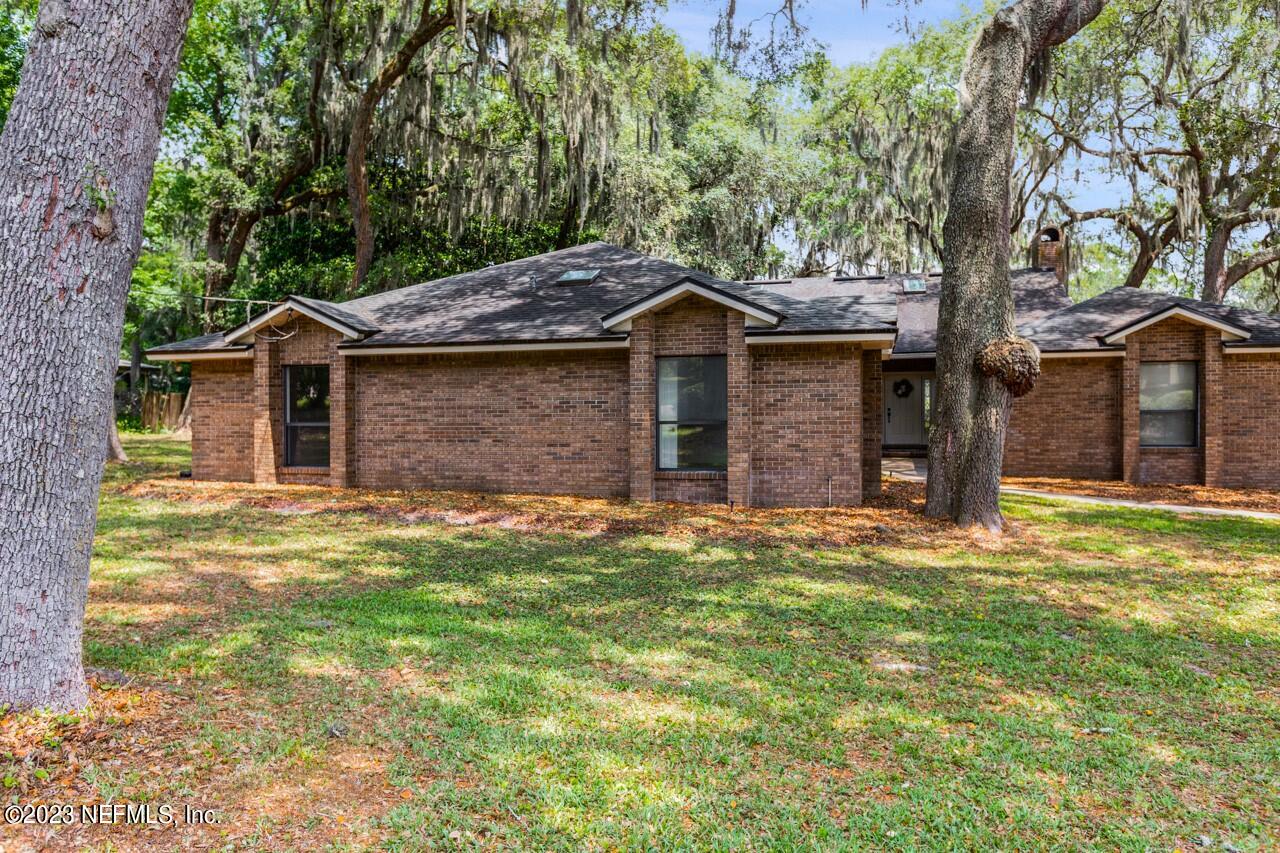 4309 Monument Road Jacksonville, FL 32225 - Photo 58 of 65 front view of a house with a yard