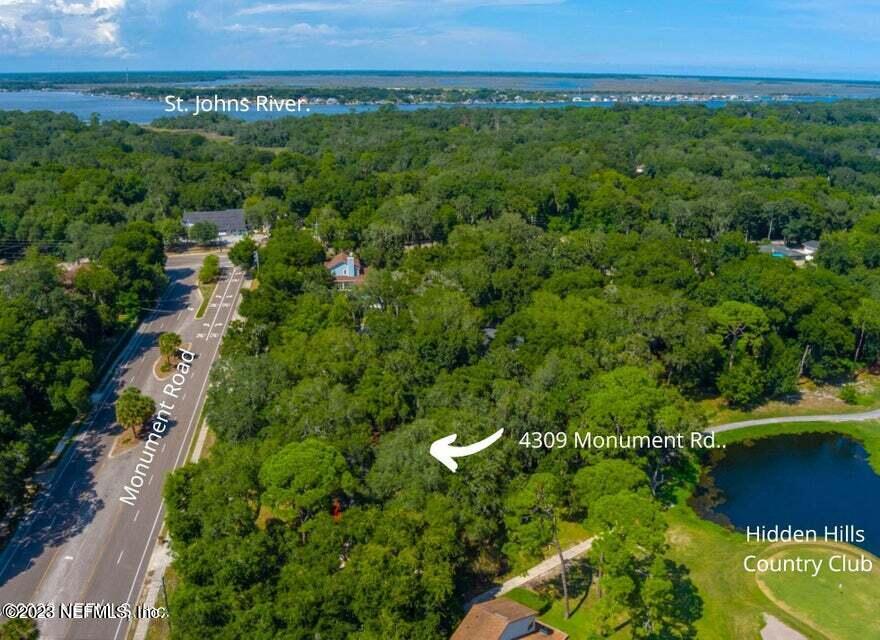 4309 Monument Road Jacksonville, FL 32225 - Photo 64 of 65 an aerial view of a house with a yard