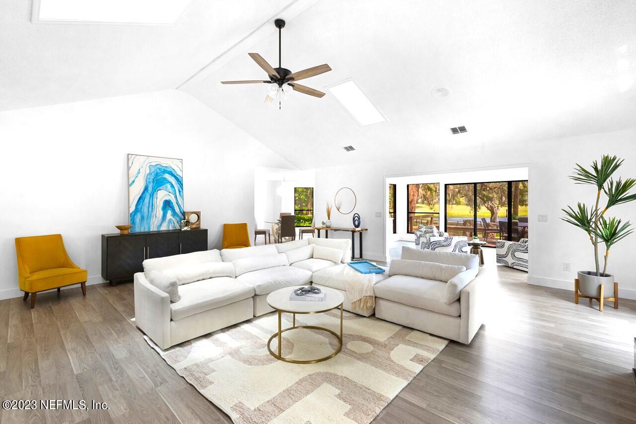 4309 Monument Road Jacksonville, FL 32225 - Photo 7 of 65 a living room with furniture and a large window