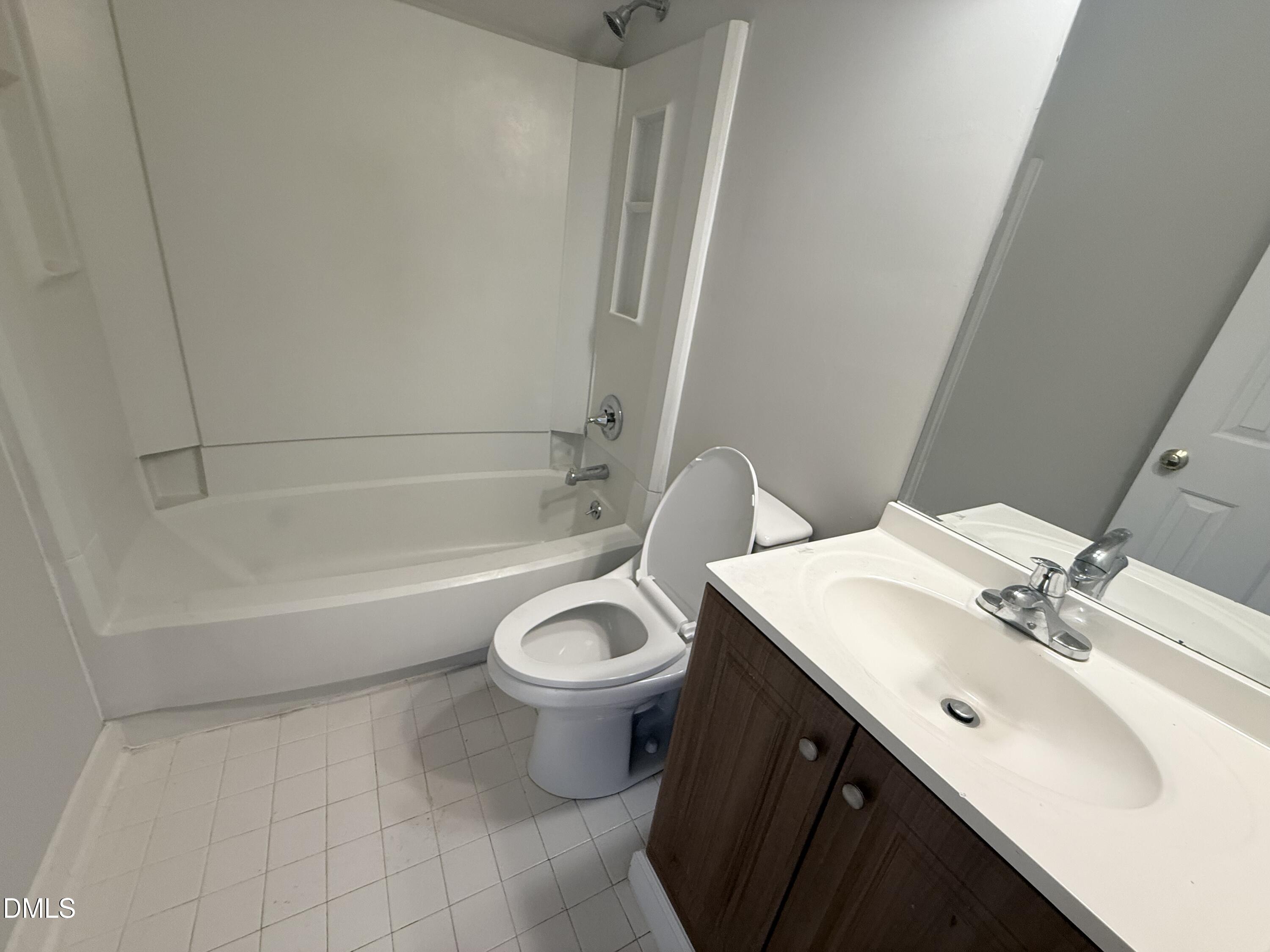 2900 Broadlands Drive Raleigh, NC 27604 - Photo 54 of 60 a bathroom with a sink and a mirror