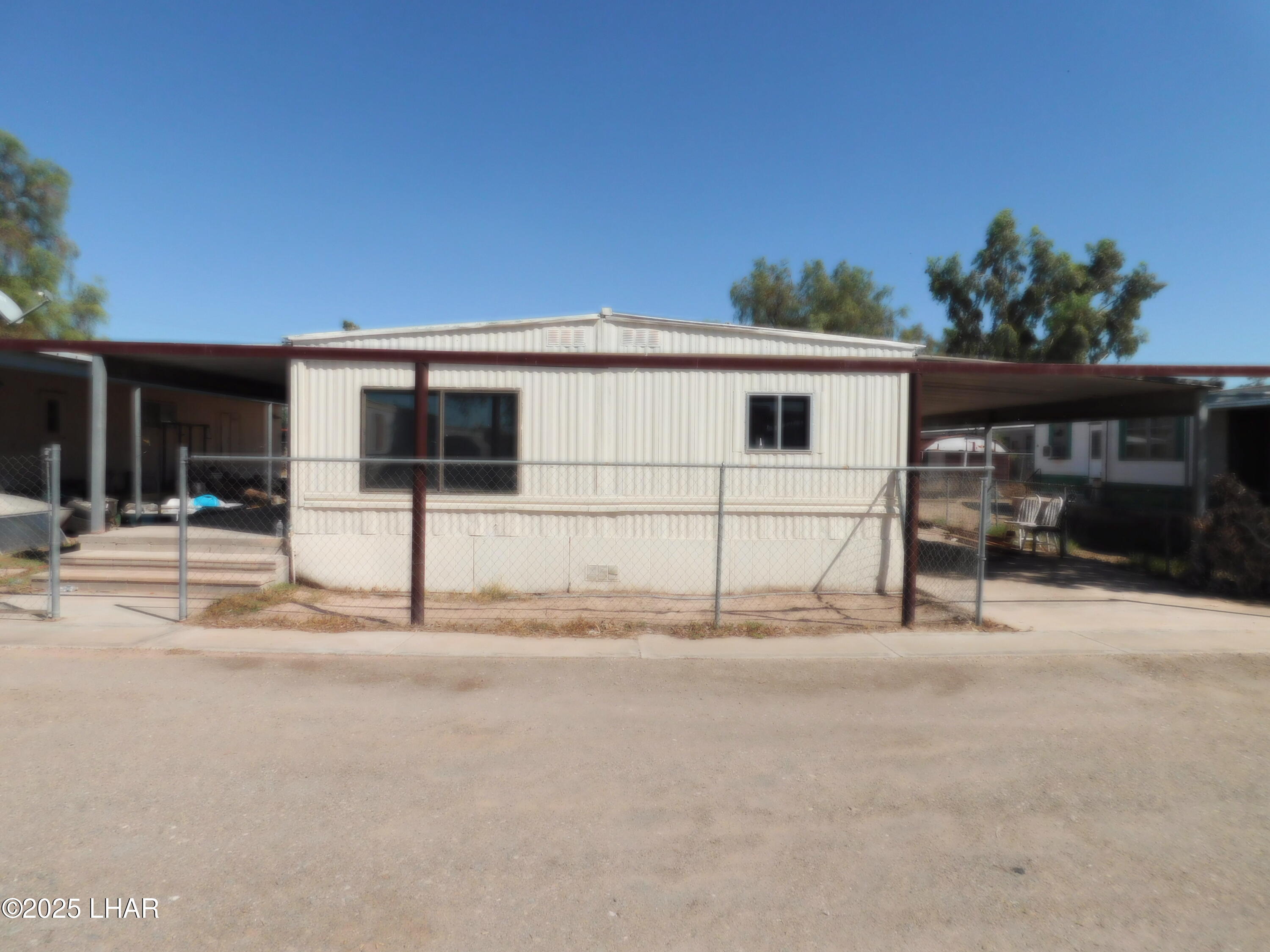 48792 Sourdough Road, Unit 29 Ehrenberg, AZ 85334 - Photo 3 of 3 front view of a house with a street