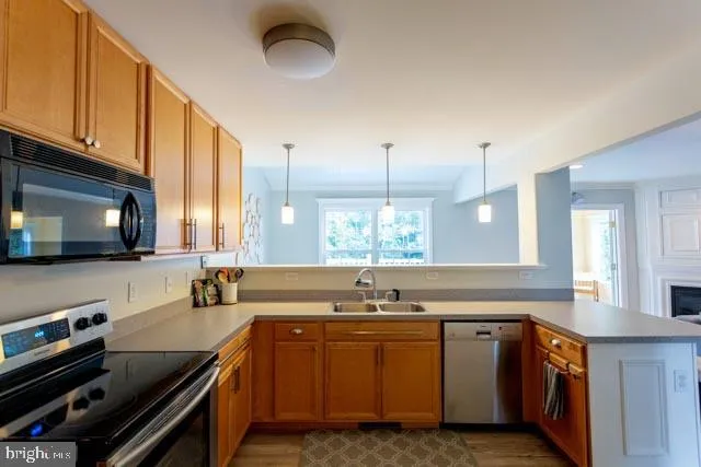 a kitchen with a sink and a stove top oven