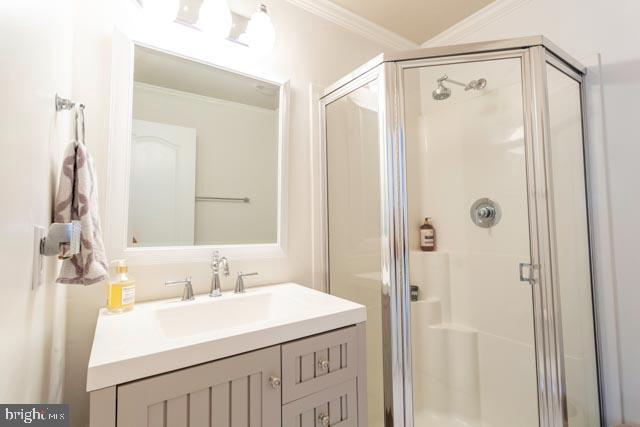 17314 King Philip Way Lewes, DE 19958 - Photo 23 of 34 a bathroom with a sink a mirror and a shower