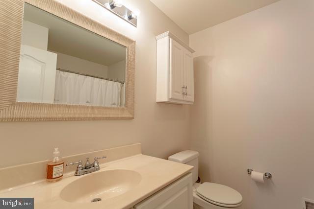 17314 King Philip Way Lewes, DE 19958 - Photo 26 of 34 a bathroom with a sink a toilet and mirror