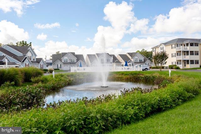17314 King Philip Way Lewes, DE 19958 - Photo 3 of 34 a view of a lake with building in front of it