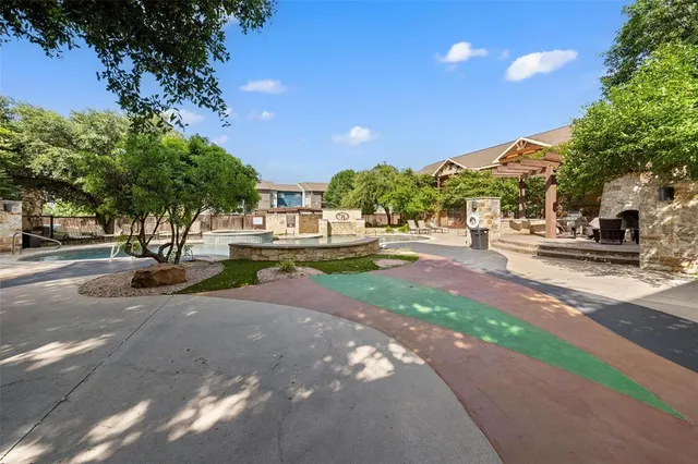 a view of a swimming pool with a patio
