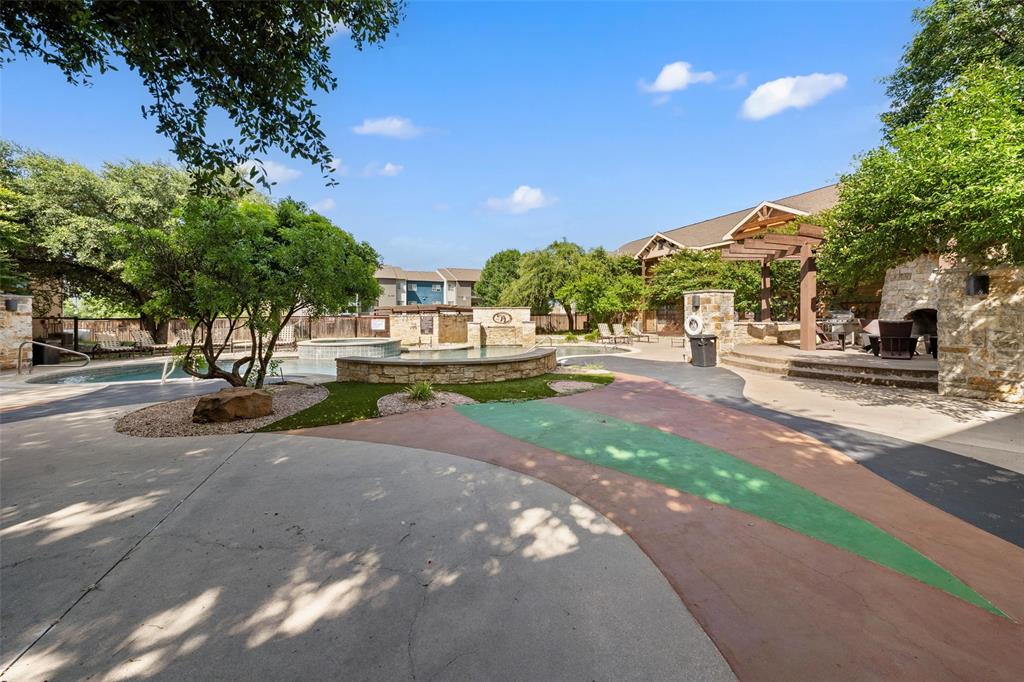 2410 South 2nd Street, Unit 1053 Waco, TX 76706 - Photo 20 of 27 Surrounding community featuring a patio and a swimming pool
