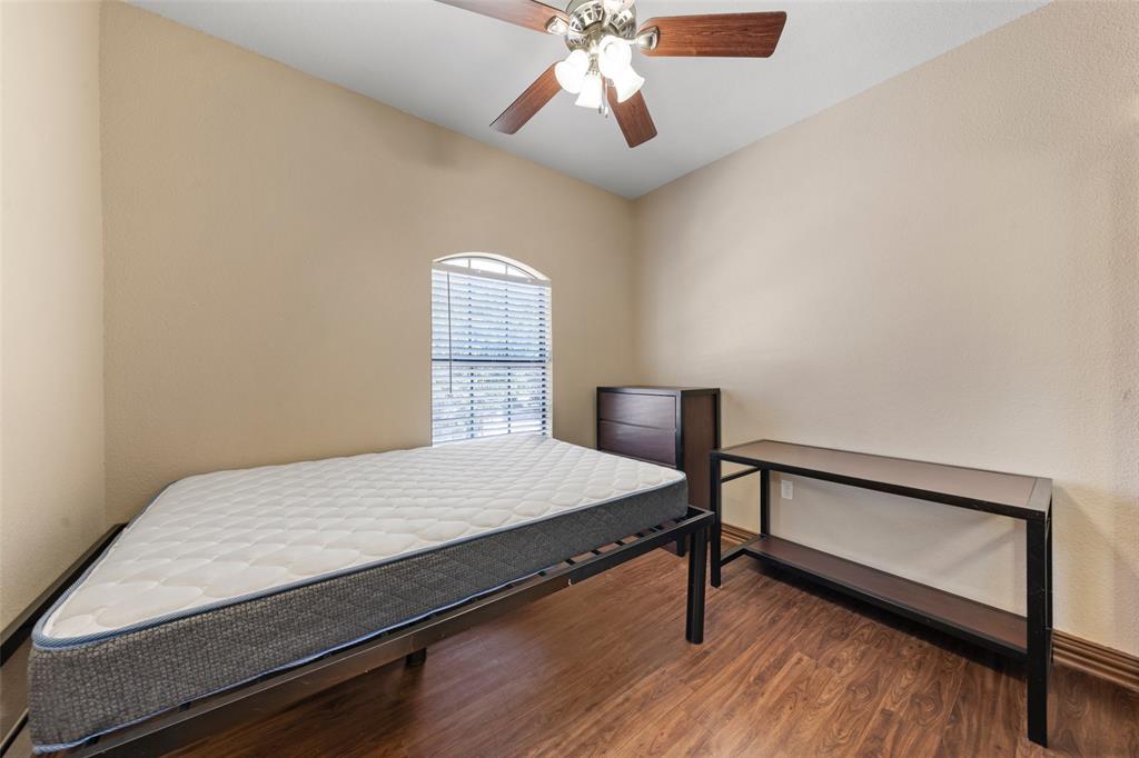 2410 South 2nd Street, Unit 1053 Waco, TX 76706 - Photo 8 of 27 Bedroom with wood finished floors and ceiling fan