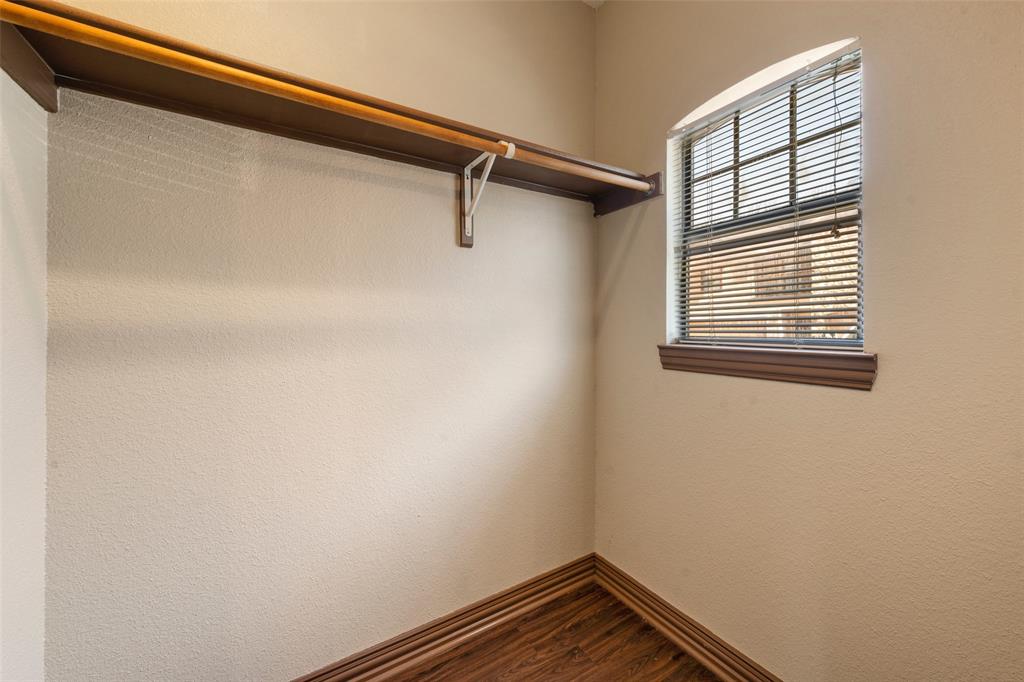 2410 South 2nd Street, Unit 1053 Waco, TX 76706 - Photo 9 of 27 Walk in closet featuring dark wood-style flooring