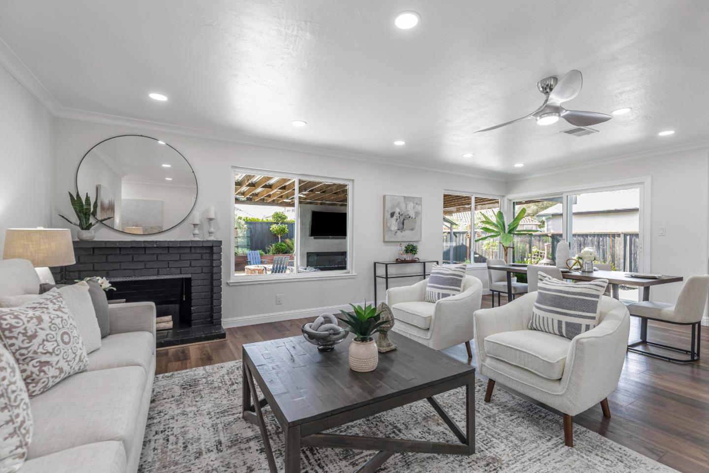 169 Turquoise Way Livermore, CA 94550 - Photo 11 of 59 a living room with furniture a fireplace and a chandelier