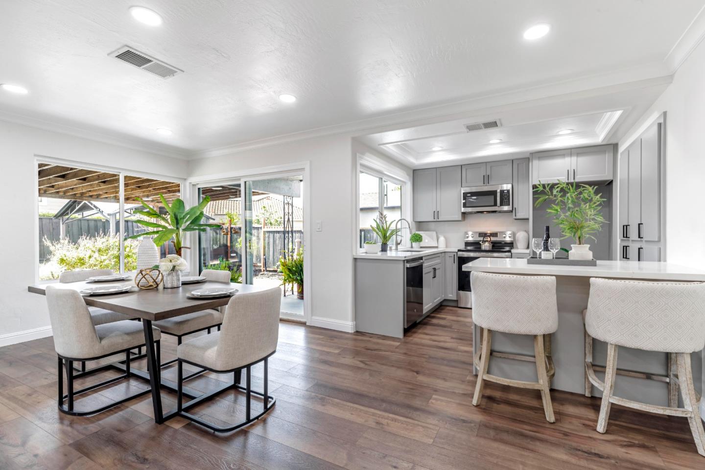 169 Turquoise Way Livermore, CA 94550 - Photo 17 of 59 a dining room with furniture a large window and wooden floor