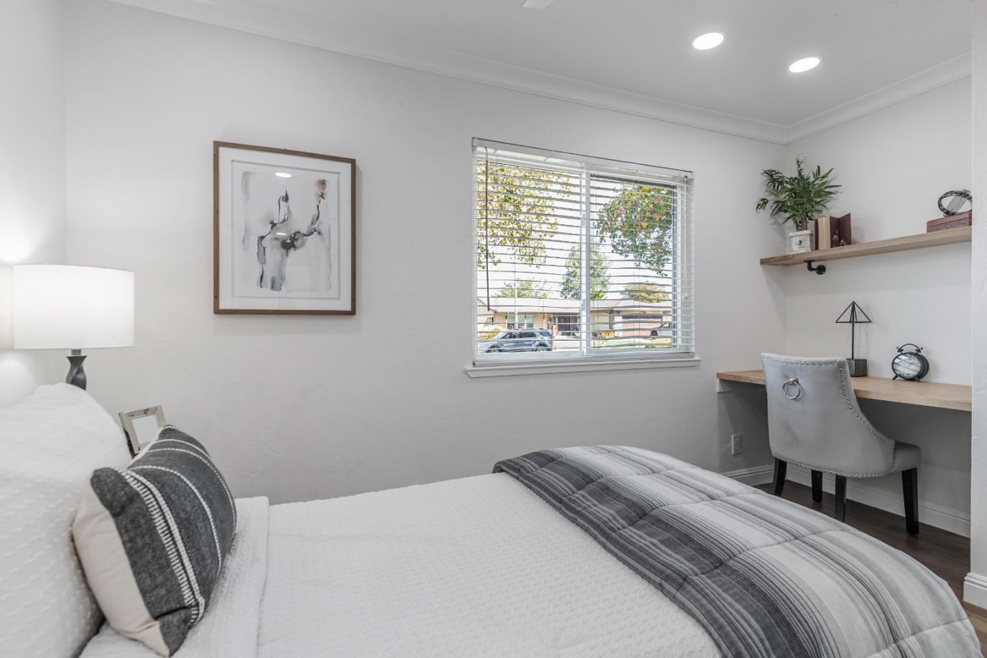 169 Turquoise Way Livermore, CA 94550 - Photo 21 of 59 a bedroom with a bed and a lamp