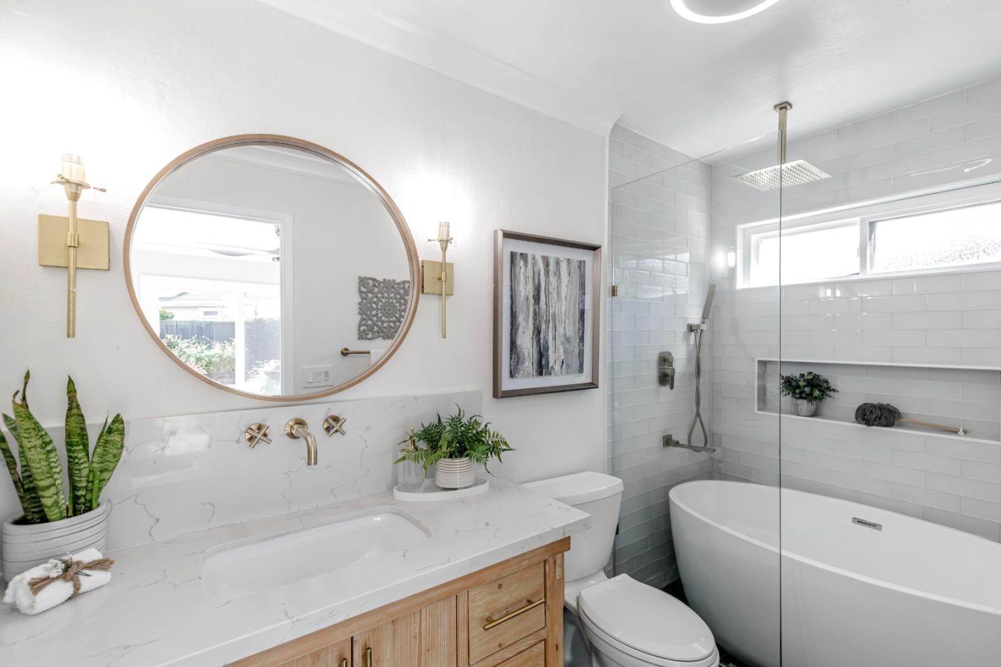 169 Turquoise Way Livermore, CA 94550 - Photo 34 of 59 a bathroom with a toilet a sink a mirror a vanity and a bathtub