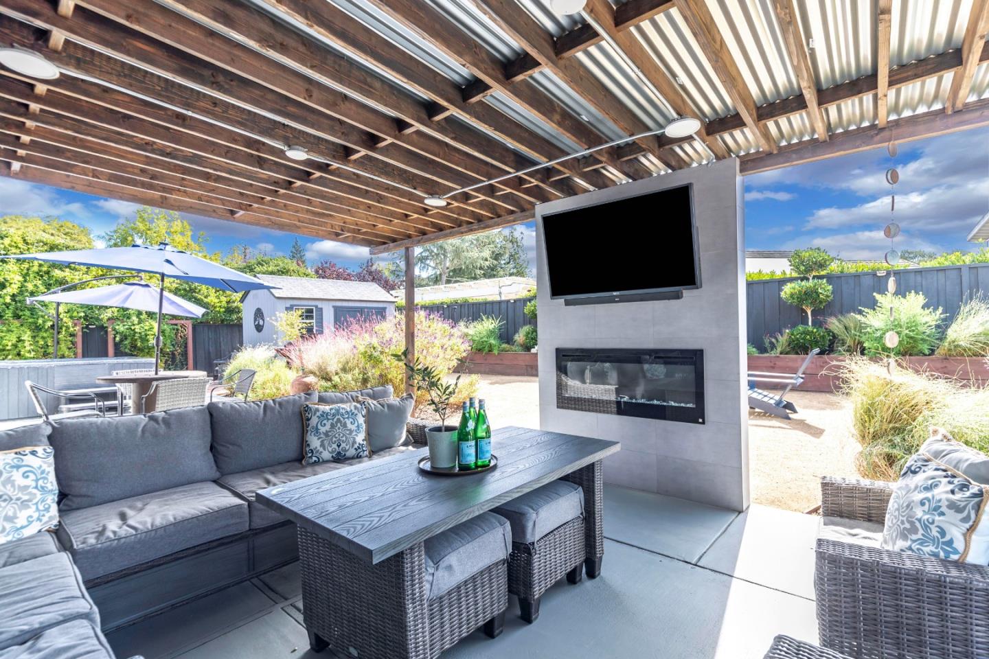 169 Turquoise Way Livermore, CA 94550 - Photo 52 of 59 a living room with patio furniture and a flat screen tv
