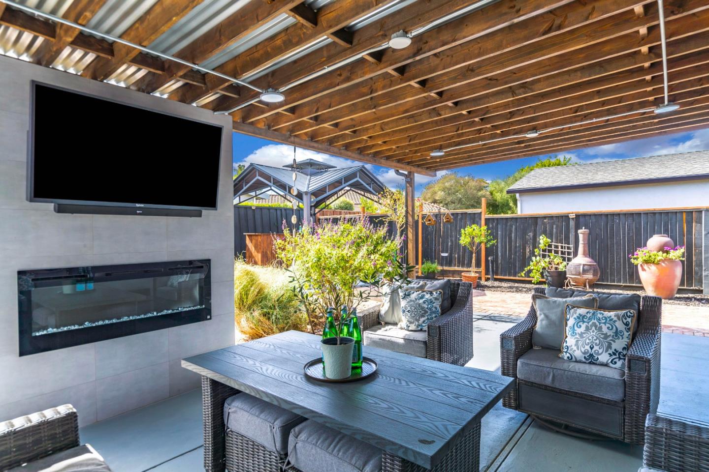 169 Turquoise Way Livermore, CA 94550 - Photo 53 of 59 a living room with furniture a flat screen tv and a fireplace