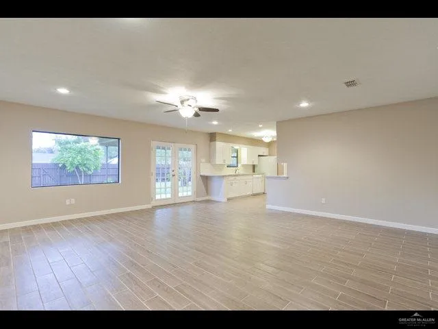 a view of an empty room with a window