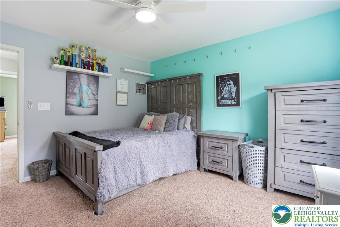 1212 Miller Road Wind Gap, PA 18091 - Photo 42 of 72 Textured carpeting and a ceiling fan create a comfortable and practical sleeping area.