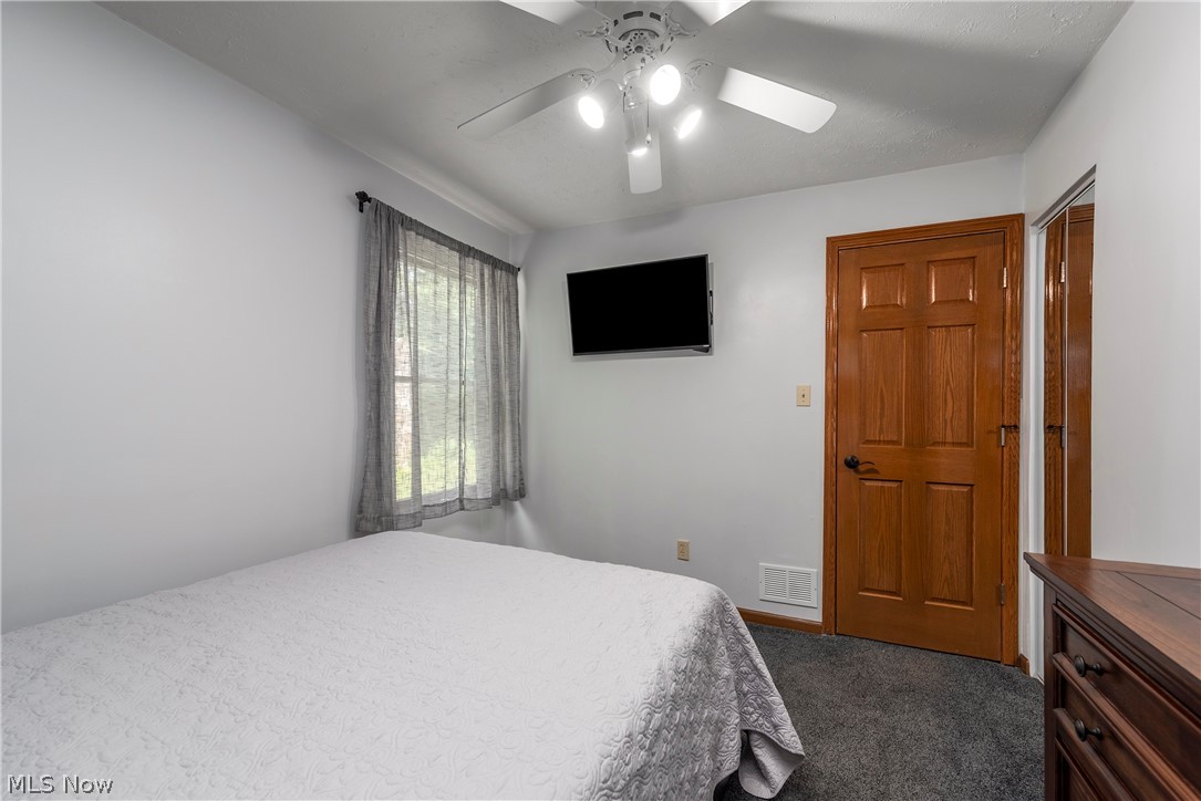 9990 Broadview Road Broadview Heights, OH 44147 - Photo 26 of 47 Bedroom with dark carpet and a ceiling fan
