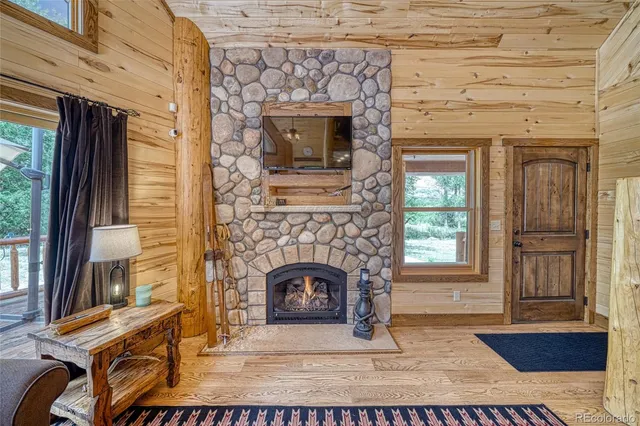 a view of an entryway with wooden floor