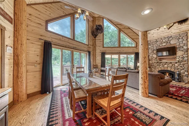 a kitchen with stainless steel appliances granite countertop a stove refrigerator and a sink
