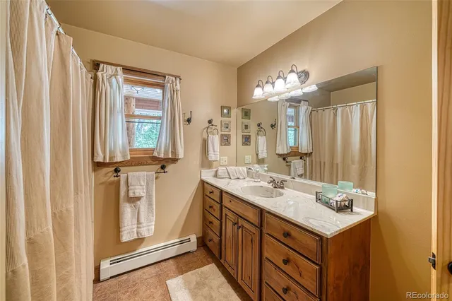 a bedroom with bed and window