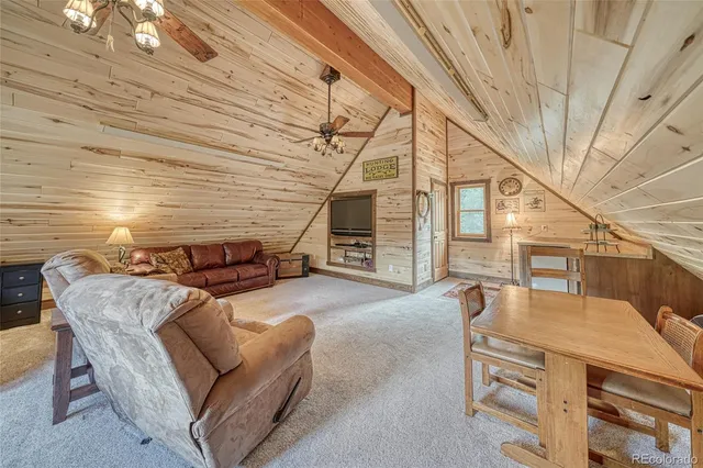 a front view of a house with lots of plants and trees