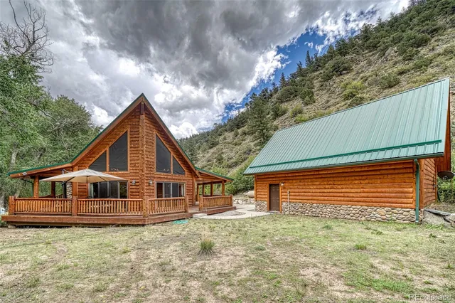 a view of a table and chairs under an umbrella