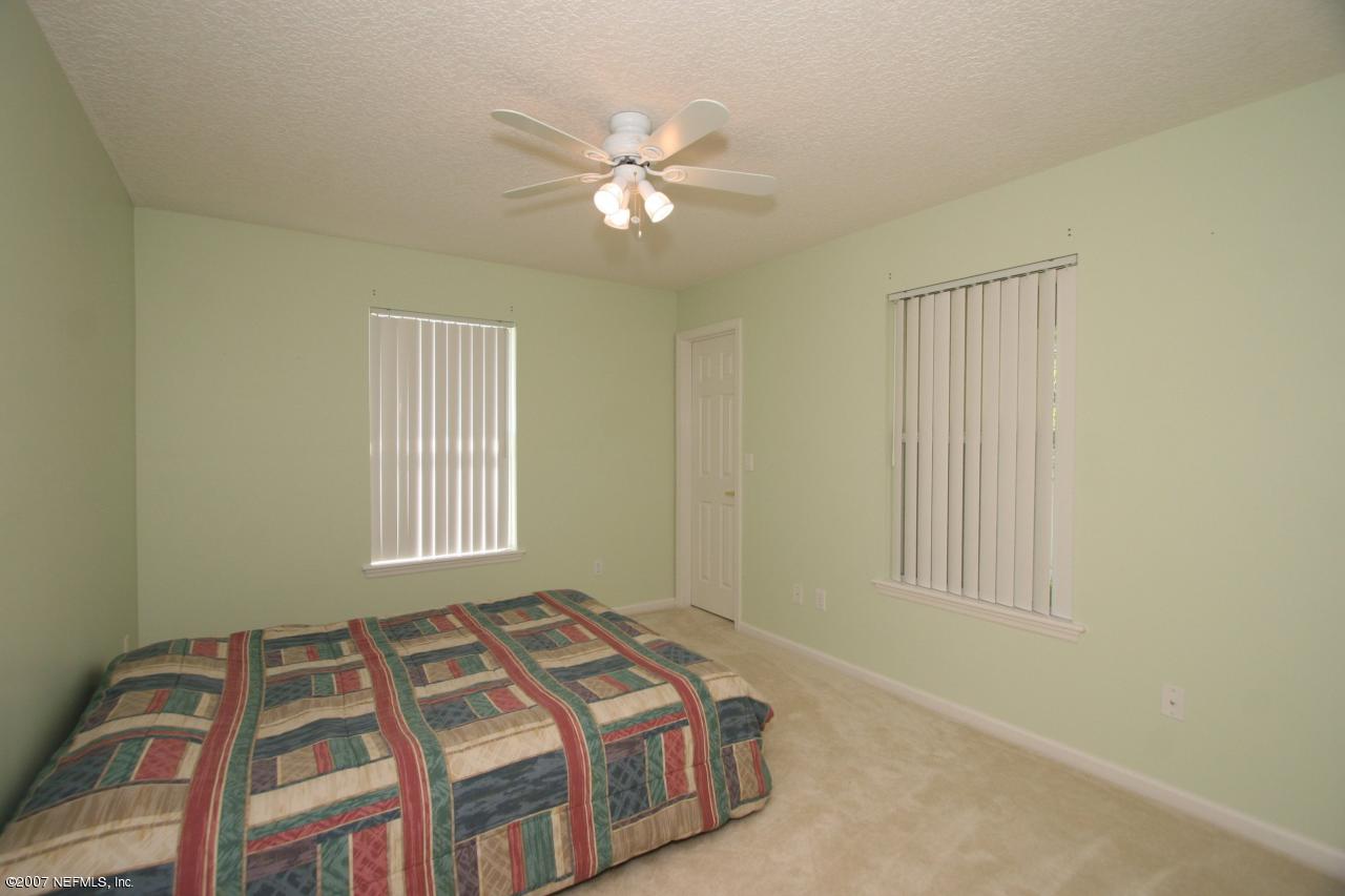 1765 Keswick Road St. Augustine, FL 32084 - Photo 7 of 12 a bedroom with a bed and a window