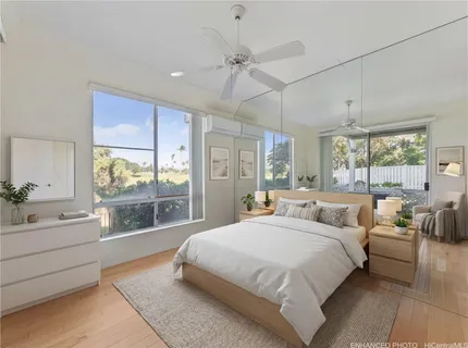 a bedroom with a large bed and a window